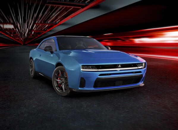 The all-new Dodge Charger SIXPACK H.O., shown here in a photo released by Stellantis, offers performance choices via multi-energy powertrain options. Dodge is unveiling two battery-powered versions of the Charger but the Stellantis brand, which has carved out a market niche of selling high performance cars, will keep selling a gas-powered Charger, minus the big V8. (Stellantis via AP)