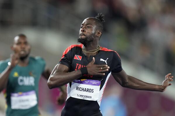 Jereem Richards of Trinidad and Tobago celebrates after winning the gold medal in the Men's 200 meters during the athletics competition in the Alexander Stadium at the Commonwealth Games in Birmingham, England, Saturday, Aug. 6, 2022. (AP Photo/Manish Swarup)