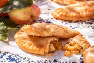 This cover image released by Mariner Books shows a recipe titled "Jack's Fried Pies," from the cookbook "Trisha’s Kitchen: Easy Comfort Food for Friends and Family” by Trisha Yearwood. (Ben Fink/Mariner Books via AP)