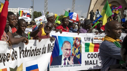 FILE - Malians demonstrate against France and in support of Russia on the 60th anniversary of the independence of the Republic of Mali, in Bamako, Mali, on September 22, 2020. The group of Russian mercenaries that briefly rebelled against authority President Vladimir Putin has been a ruthless force for hire in Africa for years, protecting the rulers at the expense of the masses.  That dynamic is not expected to change now that the group's founder, Yevgeny Prigozhin, has been exiled to Belarus as punishment for the failed rebellion.  Neither Russia nor the African leaders dependent on Wagner's fighters have any interest in ending their relations.  (Photo/AP File)