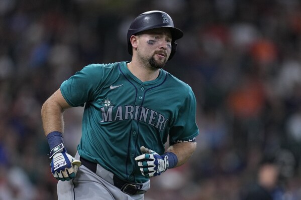 Seattle Mariners' Cal Raleigh runs the bases after hitting a go-ahead solo home run during the ninth inning of a baseball game against the Houston Astros, Sunday, May 5, 2024, in Houston. (AP Photo/Kevin M. Cox)