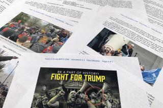 This complaint supporting the arrest warrant for Owen Shroyer is photographed in Frederick, Md., Friday, Aug. 20, 2021. Court documents show that a host of the right-wing website Infowars, Owen Shroyer, has been charged in connection to the Jan. 6 riot at the U.S. Capitol. Shroyer, who hosts "The War Room With Owen Shroyer" on the website operated by conspiracy theorist Alex Jones, faces misdemeanor charges such as disorderly conduct and entering a restricted area of Capitol grounds. (AP Photo/Jon Elswick)