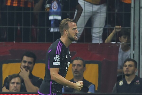 Bayern's Harry Kane, right, celebrates after scoring against Galatasaray during a Champions League group A soccer match between Galatasaray and Bayern Munich in Istanbul, Tuesday, Oct. 24, 2023. (AP Photo/Emre Otkay)