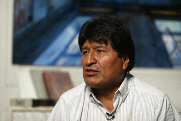 Former Bolivian President Evo Morales speaks during an interview with The Associated Press in Mexico City, Thursday, Nov. 14, 2019. Mexico granted asylum to Morales, who resigned on Nov. 10 under mounting pressure from the military and the public after his re-election victory triggered weeks of fraud allegations and deadly protests. (AP Photo/Eduardo Verdugo)