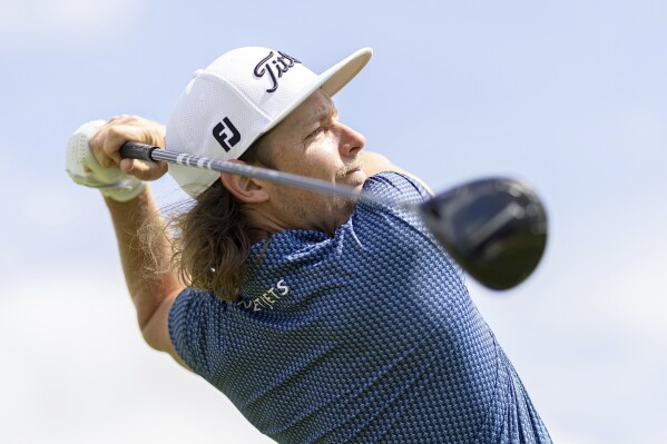 Captain Cameron Smith of Ripper GC hits his shot from the first tee during the pro-am ahead of LIV Golf London at the Centurion Club on Thursday, July 06, 2023 in Hemel Hempstead, United Kingdom. (Chris Trotman/LIV Golf via AP)