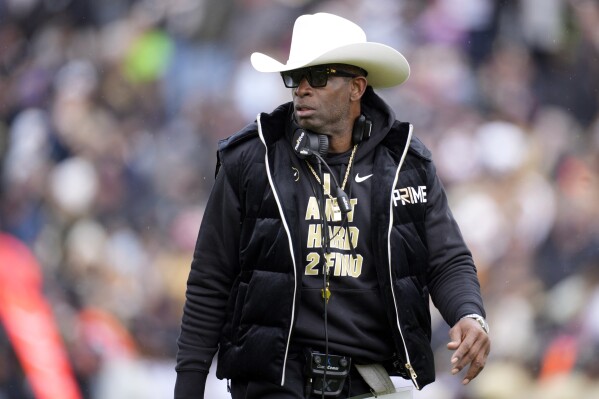 FILE - Colorado head coach Deion Sanders looks on in the first half of the team's spring practice NCAA college football game, April 22, 2023, in Boulder, Colo. Colorado opens their season at TCU on Sept. 2. (AP Photo/David Zalubowski, File)