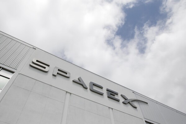 FILE - The SpaceX headquarters is seen, May 25, 2012, in Hawthorne, Calif. On Thursday, Aug. 24, 2023, the U.S. Department of Justice filed suit against SpaceX, the rocket company founded and run by Elon Musk, for alleged hiring discrimination against refugees and people seeking or already granted asylum. (AP Photo/Jae C. Hong, File)