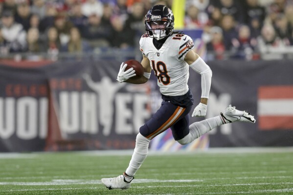 FILE - Chicago Bears wide receiver Dante Pettis (18) runs with the ball during the first half of an NFL football game against the New England Patriots, Monday, Oct. 24, 2022, in Foxborough, Mass. The Chicago Bears have signed Pettis to a one-year contract, the team announced Friday, March 15, 2024. (AP Photo/Stew Milne, File)