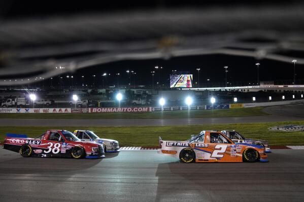 FILE - Sheldon Creed (2) races followed by Todd Gilliland (38) during a NASCAR truck series auto race at World Wide Technology Raceway Friday, Aug. 20, 2021, in Madison, Ill. (AP Photo/Jeff Roberson, File)