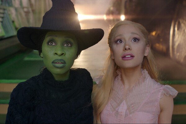This image released by Universal Pictures shows Cynthia Erivo, left, and Ariana Grande in a scene from the film "Wicked." (Universal Pictures via AP)