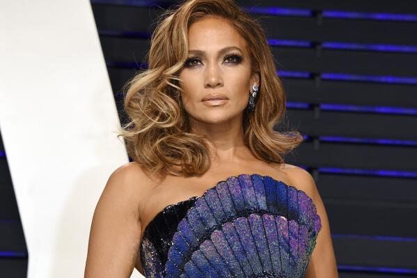 FILE - Jennifer Lopez arrives at the Vanity Fair Oscar Party on Feb. 24, 2019, in Beverly Hills, Calif. Lopez will be honored for her film and television achievements at the MTV Movie & TV Awards. The network announced Friday that Lopez will receive the Generation Award on Sunday in Santa Monica, Calif. (Photo by Evan Agostini/Invision/AP, File)