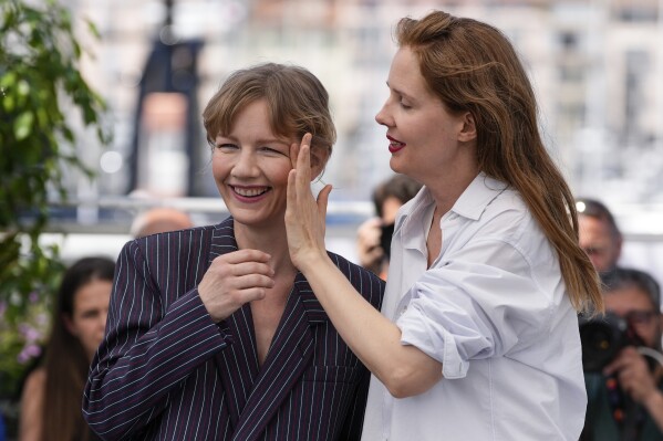 FILE - Actor Sandra Huller, left, and director Justine Triet appear at the photo call for the film "Anatomy of a Fall" at the 76th international film festival, Cannes, southern France on May 22, 2023. (Photo by Scott Garfitt/Invision/AP, File)