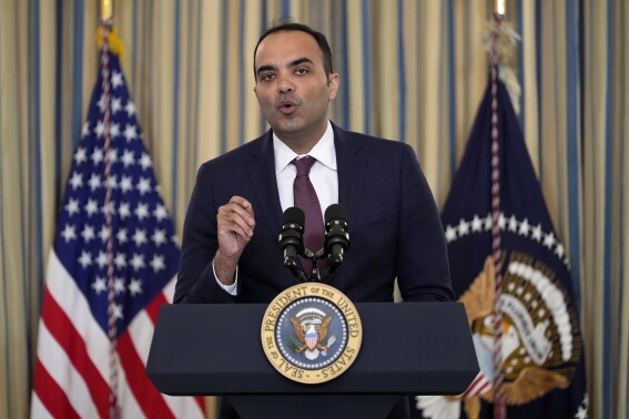 FILE - Rohit Chopra, director of the Consumer Financial Protection Bureau, speaks as President Joe Biden meets with his Competition Council to announce new actions to lower costs for families in the State Dining Room of the White House in Washington, on March 5, 2024. The CFPB said Thursday July 18, 2024 that apps that allow workers to access their paychecks in advance, often for a fee, are providing loans and should be subject to the Truth in Lending Act. (ĢӰԺ Photo/Andrew Harnik, File)
