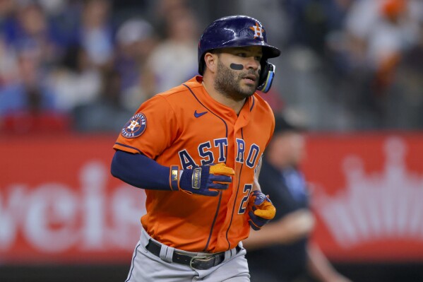 Jose Altuve placed on injured list by Astros with left oblique discomfort