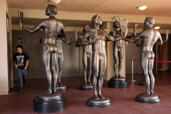 Actor statues stand outside an entrance to the Shrine Auditorium, the site of Saturday's 30th Screen Actors Guild Awards, Thursday, Feb. 22, 2024, in Los Angeles. (AP Photo/Chris Pizzello)