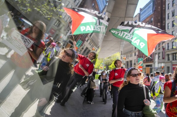 The New School students and pro-Palestinian supporters rally outside The New School University Center building, Monday, April 22, 2024, in New York. (AP Photo/Mary Altaffer)