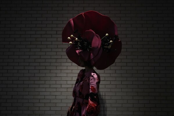 A race fan stands in a tunnel at Churchill Downs before the 151st running of the Kentucky Oaks horse race Friday, May 2, 2025, in Louisville, Ky. (AP Photo/Brynn Anderson)