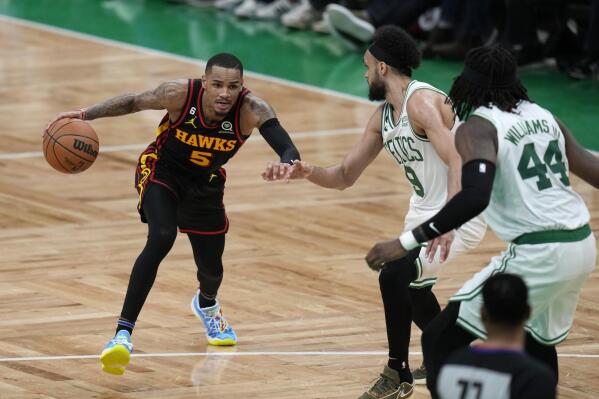 Atlanta Hawks guard Dejounte Murray (5) drives to the basket against the Boston Celtics during the second half of Game 2 in the first round of the NBA basketball playoffs, Tuesday, April 18, 2023, in Boston. (AP Photo/Charles Krupa)