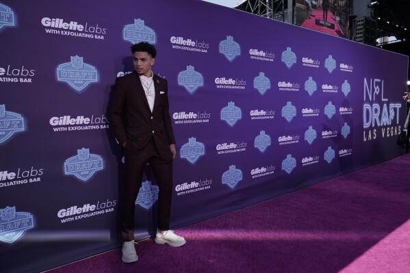 Southern California wide receiver Drake London poses on the red carpet before the first round of the NFL football draft Thursday, April 28, 2022, in Las Vegas. (AP Photo/Jae C. Hong )