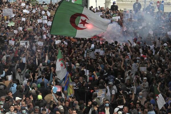 FILE - Demonstrators take the street of Algiers, Friday, April 2, 2021. As the election year commences, opposition parties are raising concerns about economic and political crises plaguing the country four years after widespread protests led to the outster of former President Abdelaziz Bouteflika. (AP Photo/ Fateh Guidoum, File)
