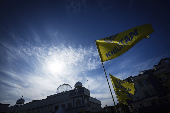 Khalistan flags are seen outside the Guru Nanak Sikh Gurdwara Sahib in Surrey, British Columbia, on Monday, Sept. 18, 2023, where temple president Hardeep Singh Nijjar was gunned down in his vehicle while leaving the temple parking lot in June. Canada expelled a top Indian diplomat Monday as it investigates what Prime Minister Justin Trudeau called credible allegations that India’s government may have had links to the assassination in Canada of a Sikh activist.(Darryl Dyck/The Canadian Press via AP)