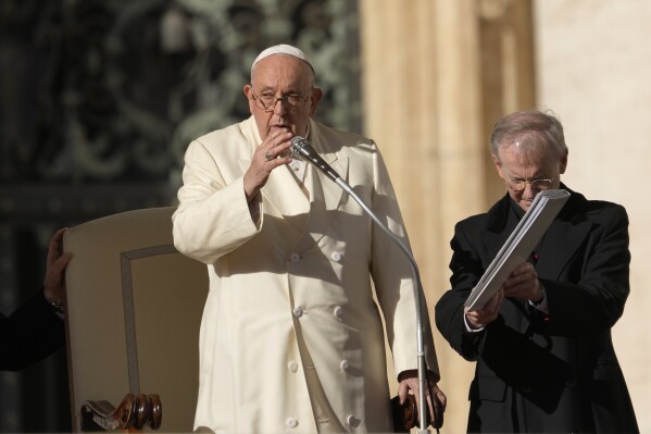 Pope Francis gives his blessing during his weekly general audience in St. Peter's Square, at the Vatican, Wednesday, Nov. 22, 2023. (AP Photo/Andrew Medichini)