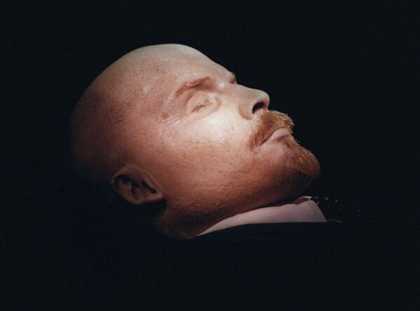 FILE - The embalmed body of Vladimir Lenin, the founder of the Soviet Union, is seen on display in his mausoleum on Moscow's Red Square, Russia, on Wednesday, April 16, 1997. This year marks the 100th anniversary of his death. While he remains lauded by Communists with his body still on view, he is more of a curiosity than a leading force in Russia. (AP Photo/Sergei Karpukhin, File)