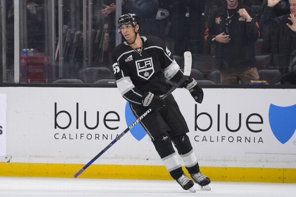 Los Angeles Kings right wing Quinton Byfield skates after scoring against the Columbus Blue Jackets during the first period of an NHL hockey game Tuesday, Feb. 20, 2024, in Los Angeles. (AP Photo/Ryan Sun)