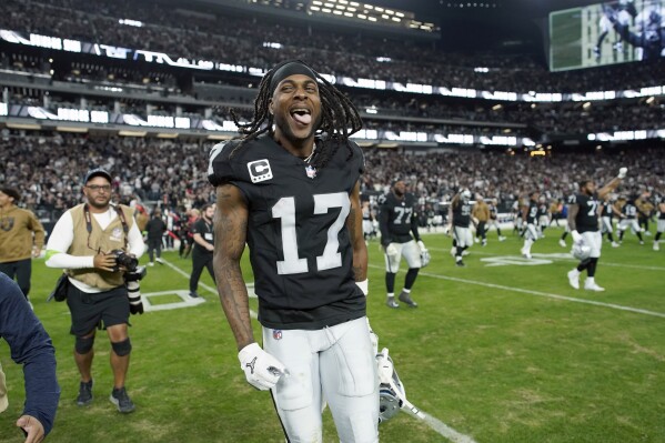 Las Vegas Raiders wide receiver Davante Adams celebrates following an NFL football game against the New York Jets Sunday, Nov. 12, 2023, in Las Vegas. The Raiders won 16-12. (AP Photo/John Locher)