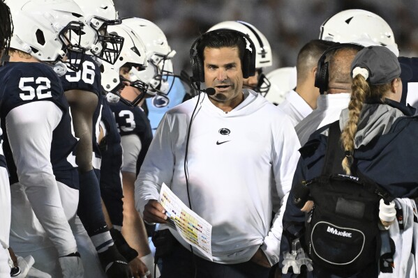 FILE -Penn State defensive coordinator Manny Diaz coaches against Iowa during the second half of an NCAA college football game, Saturday, Sept. 23, 2023, in State College, Pa. Duke has hired Penn State defensive coordinator Manny Diaz as its head coach, a person with direct knowledge of the move told The Associated Press on Thursday night, Dec. 7, 2023. (AP Photo/Barry Reeger, File)