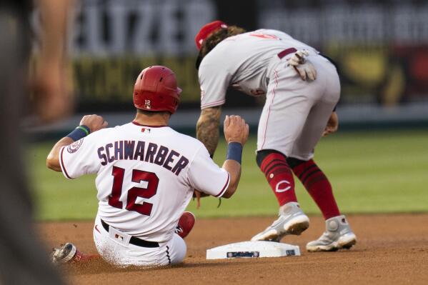 Cincinnati Reds' Kyle Farmer is hit by a pitch during the seventh inning of  the team's baseball game against the Washington Nationals in Washington,  Tuesday, May 25, 2021. (AP Photo/Manuel Balce Ceneta