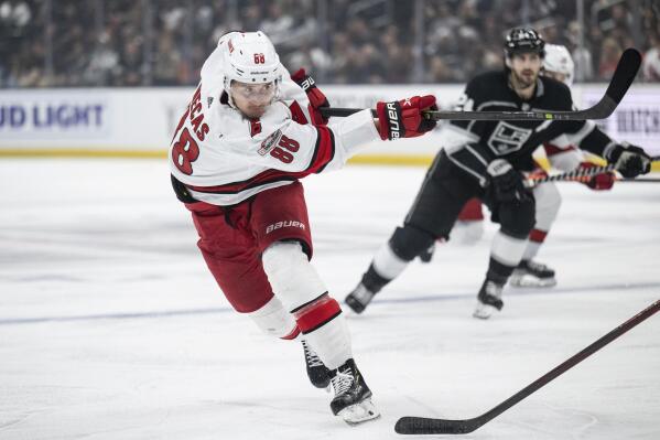 Carolina Hurricanes center Martin Necas (88) shoots during the first period of the team's NHL hockey game against Los Angeles Kings, Saturday, Dec. 3, 2022, in Los Angeles. (AP Photo/Kyusung Gong)