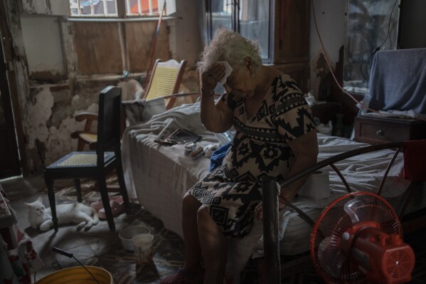 Margarita Salazar, 82, wipes the sweat off with a tissue inside her home amid high heat in Veracruz, Mexico, on June 16, 2024. Human-caused climate change intensified and made far more likely this month's killer heat with triple digit temperatures, a new flash study found Thursday, June 20. (ĢӰԺ Photo/Felix Marquez)