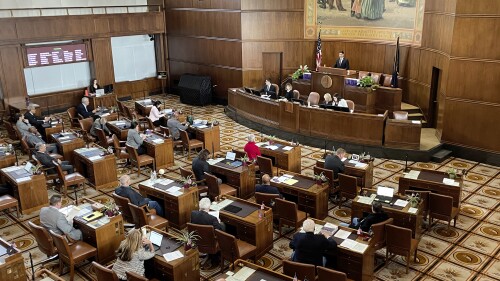FILE - The Oregon state Senate convenes for the first day of the legislative session on Tuesday, Jan. 17, 2023, at the state Capitol in Salem, Ore. Oregon lawmakers have passed amended versions of the two bills that were at the center of a six-week Republican walkout. One of the bills protects access to abortion and gender-affirming care. The other punishes the manufacturing and sale of untraceable firearms, commonly referred to as ghost guns. (AP Photo/Claire Rush, File)