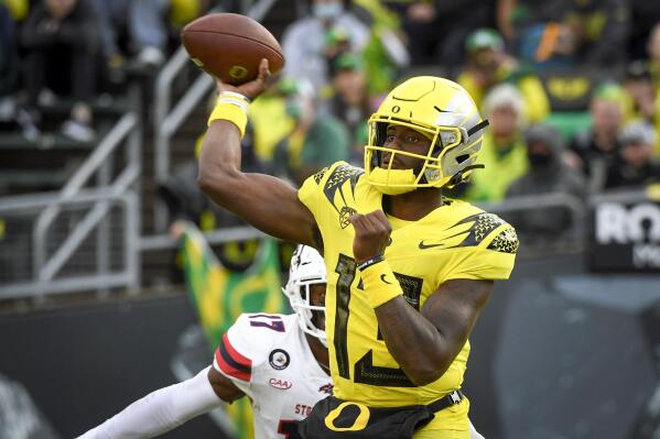 Oregon quarterback Anthony Brown (13) passes during the second quarter of an NCAA college football game against Stony Brook Saturday, Sept. 18, 2021, in Eugene, Ore. (AP Photo/Andy Nelson)