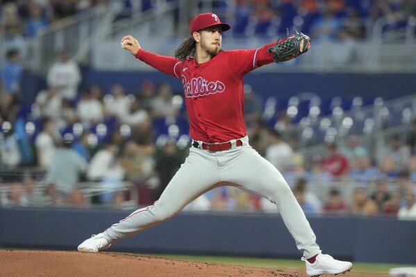 Philadelphia Phillies starting pitcher Michael Lorenzen aims a pitch during the first inning of a baseball game against the Miami Marlins, Thursday, Aug. 3, 2023, in Miami. (AP Photo/Marta Lavandier)
