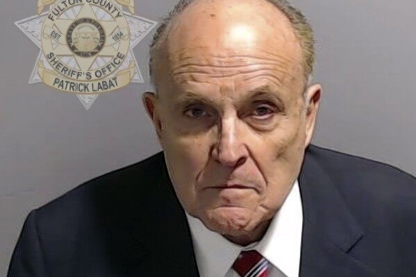 This booking photo provided by the Fulton County Sheriff's Office shows Rudy Giuliani on Wednesday, Aug. 23, 2023, in Atlanta, after he surrendered and was booked. Giuliani is charged alongside former President Donald Trump and 17 others, who are accused by Fulton County District Attorney Fani Willis of scheming to subvert the will of Georgia voters to keep the Republican president in the White House after he lost to Democrat Joe Biden. (Fulton County Sheriff's Office via AP)