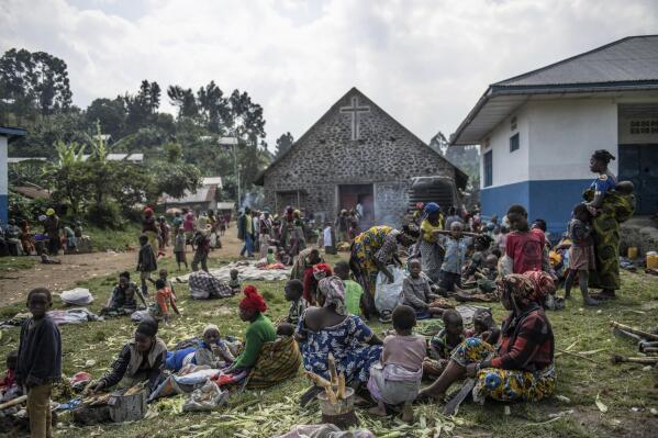 FILE - People fleeing the fighting between M23 forces and the Congolese army find refuge in a church in Kibumba, north of Goma, in Congo on Jan. 28, 2022. Kenyan authorities said Thursday, April 28, 2022 that some Congolese armed groups participating in peace talks in Kenya have asked for more time before laying down their weapons, signaling the talks have not made a breakthrough. (AP Photo/Moses Sawasawa, File)