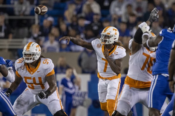 Tennessee quarterback Joe Milton III (7) throws the ball during the first half of an NCAA college football game against Kentucky in Lexington, Ky., Saturday, Oct. 28, 2023. (AP Photo/Michelle Haas Hutchins)