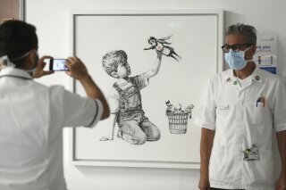 Banksy to sell paintings estimated at £1.2m to raise cash for