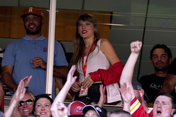 Taylor Swift watches from a suite inside Arrowhead Stadium during the first half of an NFL football game between the Chicago Bears and Kansas City Chiefs Sunday, Sept. 24, 2023, in Kansas City, Mo. (AP Photo/Ed Zurga)