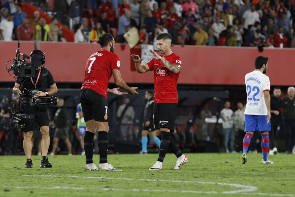 Mallorca's players react at the end of the Spanish La Liga soccer match between Mallorca and Barcelona at the Son Moix stadium in Palma de Mallorca, Spain, Tuesday, Sept. 26, 2023. (AP Photo/Francisco Ubilla)