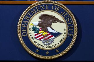 FILE - The Department of Justice seal is seen in Washington, Nov. 28, 2018. President Joe Biden campaigned on a pledge to work toward abolishing federal capital punishment. But his Justice Department continues to press for the death penalty in certain cases — even as a moratorium means no federal executions are likely to happen anytime soon. (AP Photo/Jose Luis Magana, File)