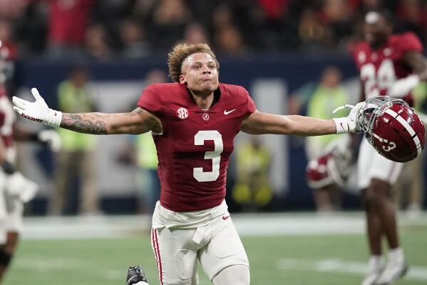 Alabama wide receiver Jermaine Burton (3) celebrates after a win against Georgia after the Southeastern Conference championship NCAA college football game in Atlanta, Saturday, Dec. 2, 2023. (AP Photo/Mike Stewart)