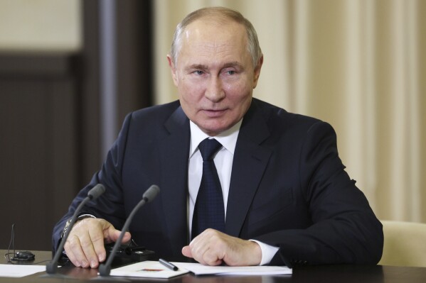 Russian President Vladimir Putin speaks to Gen. Zhang Youxia, vice chairman of China's Central Military Commission during a meeting at the Novo-Ogaryovo residence outside Moscow, Russia, Wednesday, Nov. 8, 2023. (Gavriil Grigorov, Sputnik, Kremlin Pool Photo via AP)