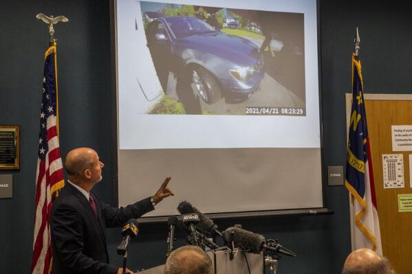 Pasquotank County District Attorney Andrew Womble shows still images from police body camera footage after announcing he will not charge deputies in the April 21 fatal shooting of Andrew Brown Jr. during a news conference Tuesday, May 18, 2021 at the Pasquotank County Public Safety building in Elizabeth City, N.C. Womble said he would not release bodycam video of the confrontation between Brown, a Black man, and the law enforcement officers.  (Travis Long/The News & Observer via AP)