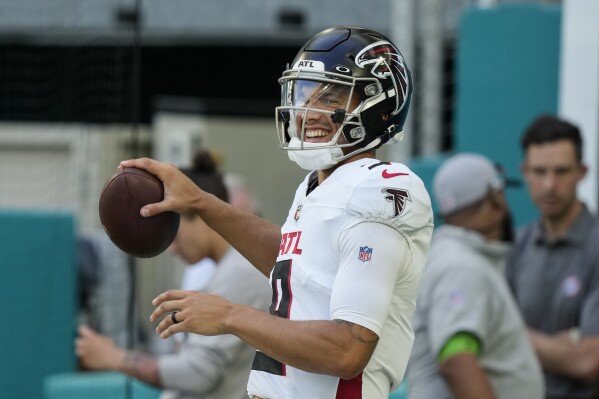 Atlanta Falcons quarterback Desmond Ridder warms up before a preseason an NFL football game against the Miami Dolphins, Friday, Aug. 11, 2023, in Miami Gardens, Fla. (AP Photo/Marta Lavandier)