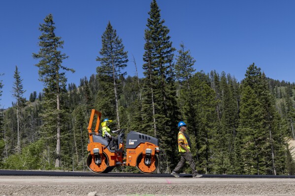 Construction takes place on the Teton Pass on June 25, 2024 near Jackson, Wyo. (AP Photo/Natalie Behring, File)