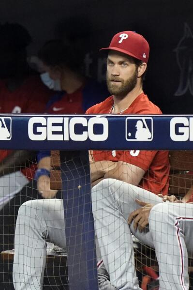 Bryce Harper of the Philadelphia Phillies looks on from the dugout