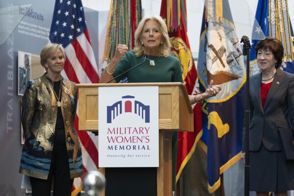First lady Jill Biden, center, with Phyllis Wilson, President of the Military Women's Memorial, left, and Sen. Susan Collins, R-Maine, speaks during an event honoring women in the military on the 75th Anniversary of the Women's Armed Services Integration Act, Monday, June 12, 2023, in Arlington, Va., at the Military Women's Memorial at Arlington National Cemetery. (AP Photo/Jacquelyn Martin)
